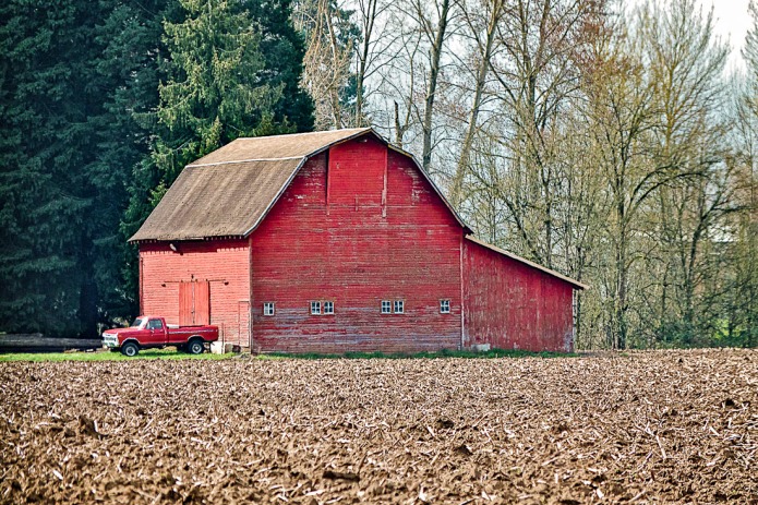 Barn and plowed field.
