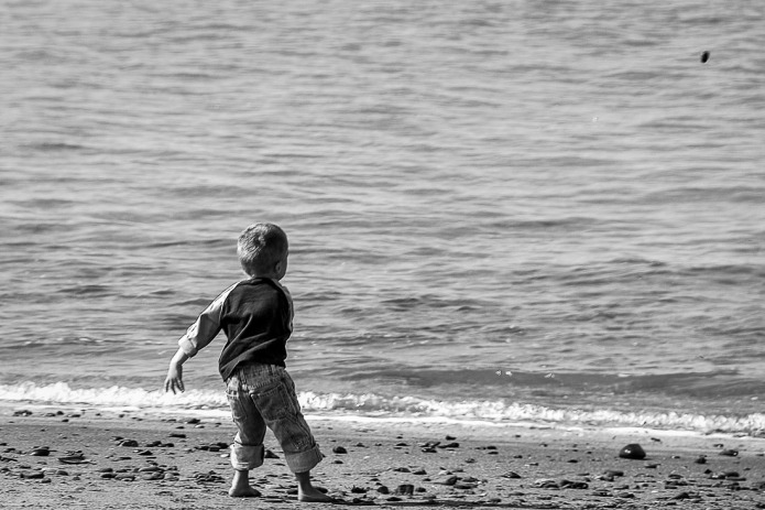 Children being themselves or in this case throwing stones in the ocean always makes me happy to watch.