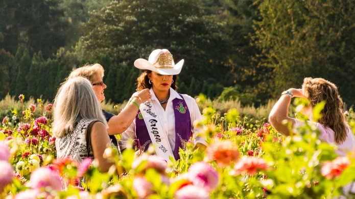 A candid capture of Miss Rodeo Oregon 2014 Oregon Photoshoot at Swan Island Dahlias.