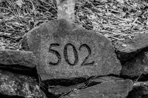 Carved address in rock.