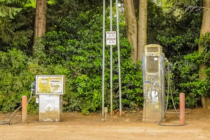 Vintage gas pump (on right) and much newer gas pump on left.